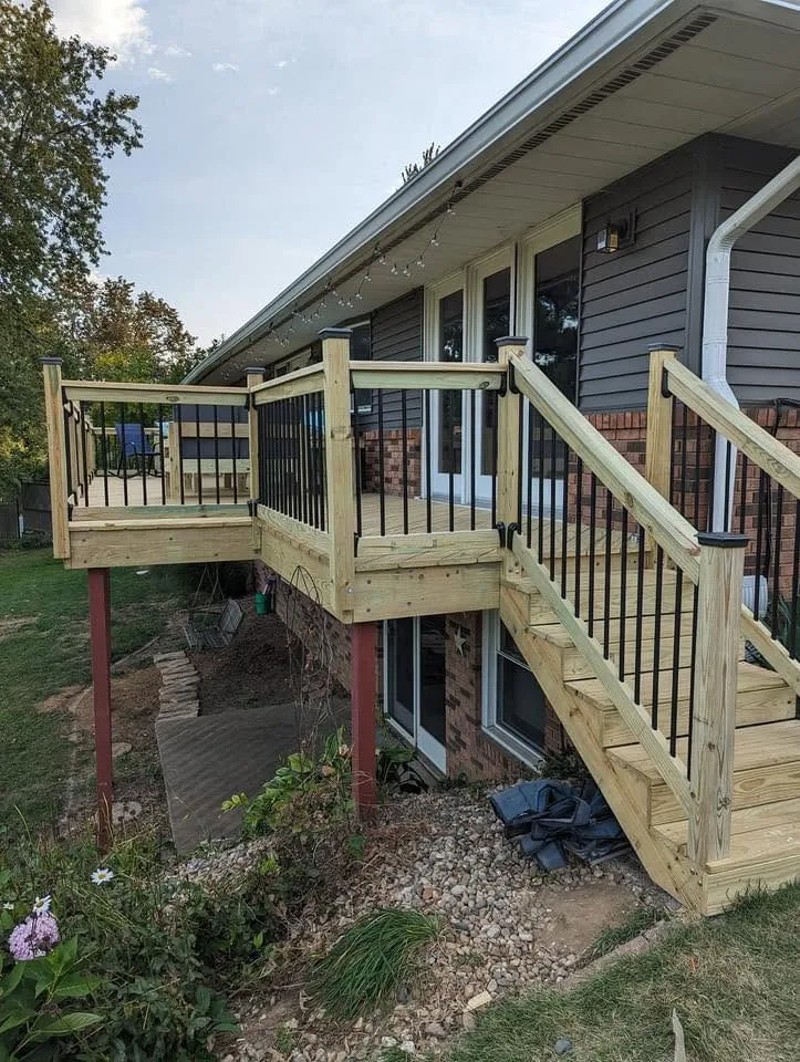 Deck under construction on a sloped backyard in Peoria, IL