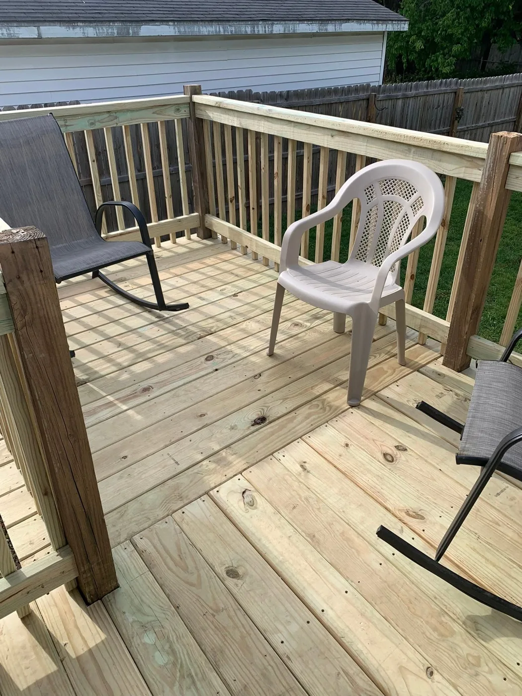 Fresh deck boards on a rebuilt backyard deck in Pekin, IL