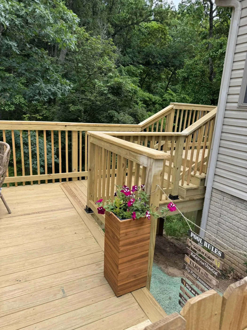 Wood deck with built-in planter boxes and blooming tulips in Central Illinois