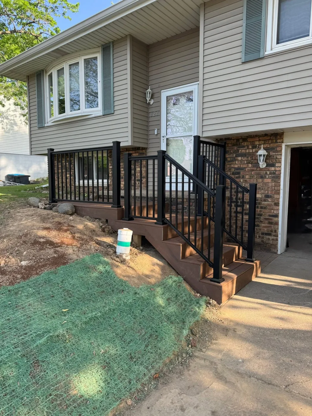 New black aluminum railing installed at a home entry in Central Illinois
