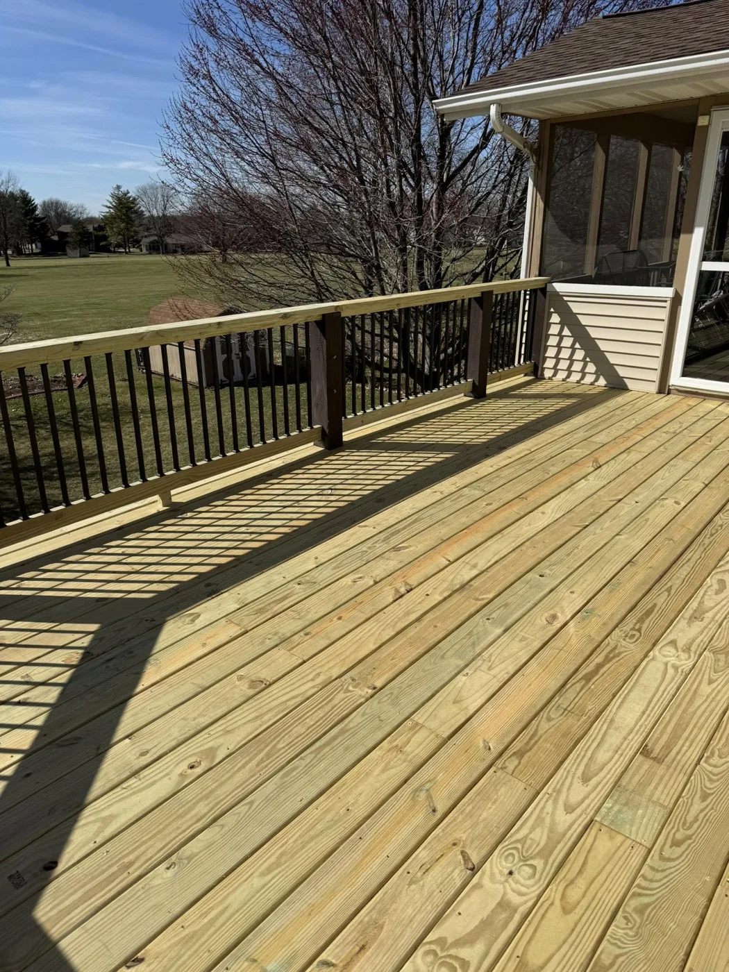 Newly built pressure-treated wood deck in Pekin, Illinois